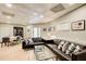 Stylish living room features light walls, leather sofas, and unique ceiling design at 8531 Lake Dr, Snellville, GA 30039