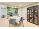 The stylish living room features light walls, a wet bar, and seating for four at 8531 Lake Dr, Snellville, GA 30039