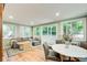 Bright and airy living room with hardwood floors, a gray sectional sofa, and sliding glass doors to the outside at 8531 Lake Dr, Snellville, GA 30039