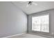 Bedroom featuring a vaulted ceiling, ceiling fan, and large window with blinds at 1126 Village Ct, Atlanta, GA 30316