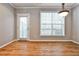 Dining area with hardwood floors and a large window providing natural light at 1126 Village Ct, Atlanta, GA 30316