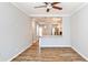 Open living room with wood floors showcasing the kitchen with stainless steel appliances at 1126 Village Ct, Atlanta, GA 30316