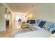 Open-concept living area with hardwood floors, a fireplace, and a dining area with ample seating and stylish decor at 3677 Blackshear Ct, Duluth, GA 30096