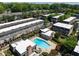 Aerial view showcasing the community, pool area, and lush green surroundings at 6980 Roswell Rd # N5, Atlanta, GA 30328