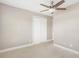 Bedroom featuring neutral walls, plush carpeting, ceiling fan, and closet at 6980 Roswell Rd # N5, Atlanta, GA 30328