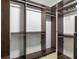 Spacious walk-in closet with multiple rods and shelving for organized storage at 6980 Roswell Rd # N5, Atlanta, GA 30328