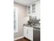 Well-appointed kitchen area featuring gray backsplash, granite counters, stainless steel appliances, and ample storage at 6980 Roswell Rd # N5, Atlanta, GA 30328