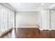 Bright living area boasts hardwood floors, neutral walls, and recessed lighting at 6980 Roswell Rd # N5, Atlanta, GA 30328