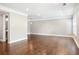 Open-concept living room with hardwood floors and neutral paint, lots of space at 6980 Roswell Rd # N5, Atlanta, GA 30328