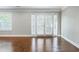 Spacious living room features gleaming hardwood floors and natural light at 6980 Roswell Rd # N5, Atlanta, GA 30328