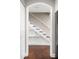 Open staircase featuring built-in shelving, providing a functional and stylish design element to the home at 6980 Roswell Rd # N5, Atlanta, GA 30328