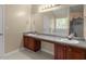 Bathroom featuring double sinks, granite countertops, and a separate tub and shower at 802 Cormac Dr, Riverdale, GA 30296