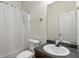 Well-lit bathroom featuring a shower-tub combo, modern vanity, and a large mirror at 802 Cormac Dr, Riverdale, GA 30296