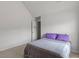 Minimalist bedroom with gray bedding, purple pillows, and ample natural light at 802 Cormac Dr, Riverdale, GA 30296