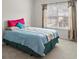 Bright bedroom with a queen bed, window with curtains, and neutral carpet at 802 Cormac Dr, Riverdale, GA 30296