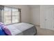 Bright bedroom with a comfortable bed and natural lighting from a window at 802 Cormac Dr, Riverdale, GA 30296