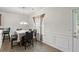 Bright dining room with wainscoting, a chandelier and lots of natural light at 802 Cormac Dr, Riverdale, GA 30296