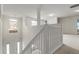 Foyer with staircase, railing and large windows for natural light at 802 Cormac Dr, Riverdale, GA 30296