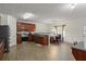 Open concept kitchen and breakfast nook with stainless appliances and wood cabinets at 802 Cormac Dr, Riverdale, GA 30296