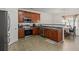 Kitchen with stainless steel appliances, wood cabinets and access to dining area at 802 Cormac Dr, Riverdale, GA 30296