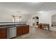 Bright kitchen area with stainless steel dishwasher and adjacent desk space at 802 Cormac Dr, Riverdale, GA 30296