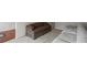 Cozy living room featuring neutral walls and plush sofas with view of hardwood floors at 802 Cormac Dr, Riverdale, GA 30296