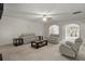 Spacious living room with neutral colored couches and a dark coffee table at 802 Cormac Dr, Riverdale, GA 30296