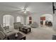 Open living room with access to the kitchen and other living spaces at 802 Cormac Dr, Riverdale, GA 30296