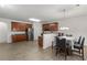 Open-concept space with kitchen, dining area, and hardwood flooring at 802 Cormac Dr, Riverdale, GA 30296