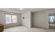 Neutral loft with a window, carpet flooring, and neutral color scheme at 802 Cormac Dr, Riverdale, GA 30296