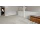 Loft with neutral carpet and walls, and a wooden cabinet at 802 Cormac Dr, Riverdale, GA 30296