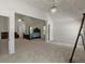 Spacious main bedroom with a vaulted ceiling, chandelier, and lots of natural light at 802 Cormac Dr, Riverdale, GA 30296