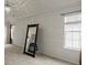 Bright main bedroom with white walls and a decorative chandelier at 802 Cormac Dr, Riverdale, GA 30296