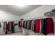 Spacious walk-in closet with ample hanging space for clothing and storage at 802 Cormac Dr, Riverdale, GA 30296