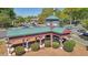 Aerial view featuring 'Roswell Mill' with a covered walkway and surrounding landscape at 171 Riverview Trl, Roswell, GA 30075