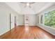 A spacious bedroom with hardwood floors and view of nature at 171 Riverview Trl, Roswell, GA 30075