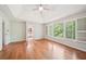 Large bedroom with ample natural light and hard wood flooring at 171 Riverview Trl, Roswell, GA 30075