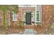 Charming brick and siding home with a well-maintained front yard and welcoming entrance at 171 Riverview Trl, Roswell, GA 30075