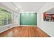 Living room with hardwood floors, a fireplace, and a pass-through to the kitchen at 171 Riverview Trl, Roswell, GA 30075