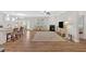 Open living area with hardwood floors, fireplace, and plenty of natural light at 427 Bluffs View Ln, Canton, GA 30114
