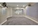 Spacious basement area with large mirrors, making it ideal for a home gym or studio at 8935 Muirfield Ct, Duluth, GA 30097