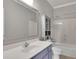 Bathroom with single sink vanity, tile flooring and shower/tub combination at 8935 Muirfield Ct, Duluth, GA 30097