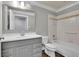 Bathroom featuring modern vanity, shower, and tiled tub at 8935 Muirfield Ct, Duluth, GA 30097