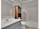 Bathroom with a single sink vanity, tile flooring, and shower/tub combination at 8935 Muirfield Ct, Duluth, GA 30097