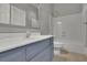 Bathroom with single sink vanity, tile flooring and shower/tub combination at 8935 Muirfield Ct, Duluth, GA 30097