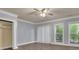 Comfortable bedroom boasts natural light, a ceiling fan, and ample closet space at 8935 Muirfield Ct, Duluth, GA 30097