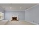 Bright bedroom featuring a fireplace, neutral walls and carpet floors at 8935 Muirfield Ct, Duluth, GA 30097