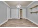 Bright bedroom features modern lighting, built-in shelves and closet for ample storage at 8935 Muirfield Ct, Duluth, GA 30097