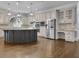 Kitchen features large island, stainless steel appliances, and custom cabinets at 8935 Muirfield Ct, Duluth, GA 30097