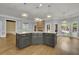 Elegant kitchen island with granite countertops, custom cabinetry, and pendant lighting at 8935 Muirfield Ct, Duluth, GA 30097